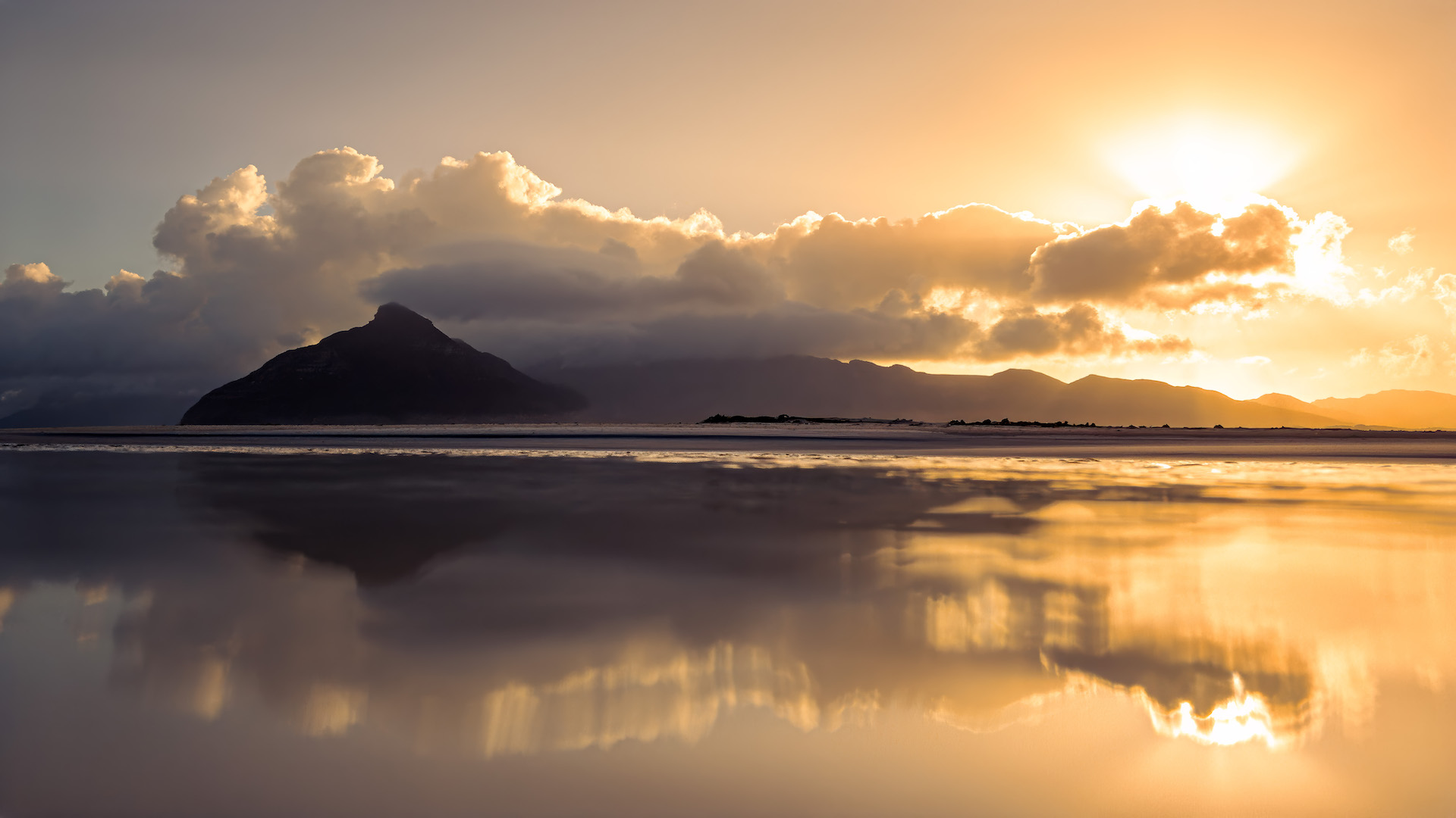 Chapman's peak sunset from Kommetjie long beach