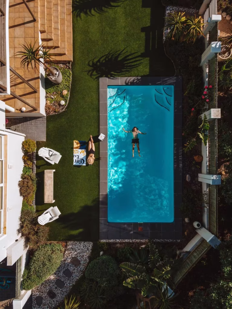aerial shot of the front garden and large electric heated pool